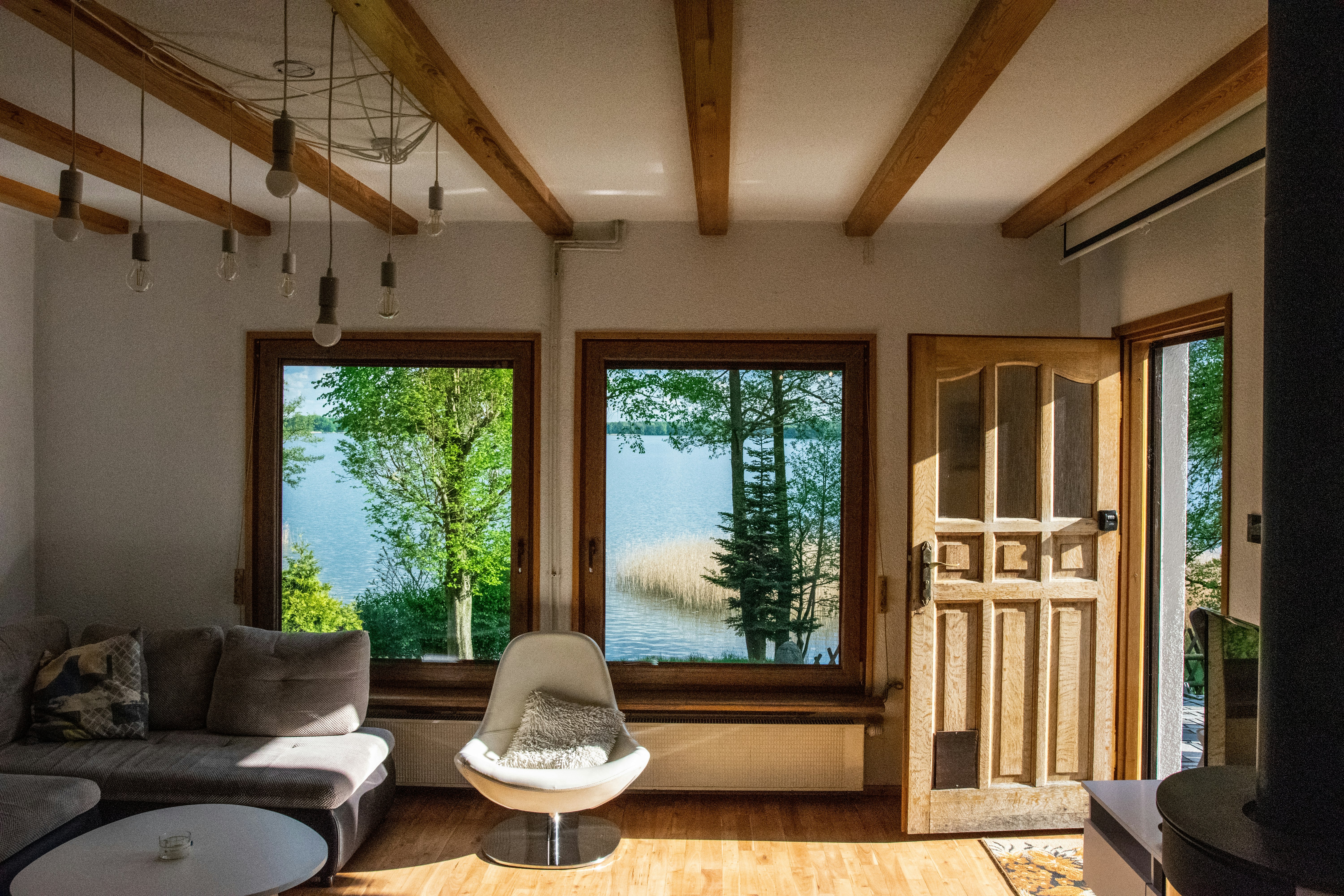 white and black sofa near window